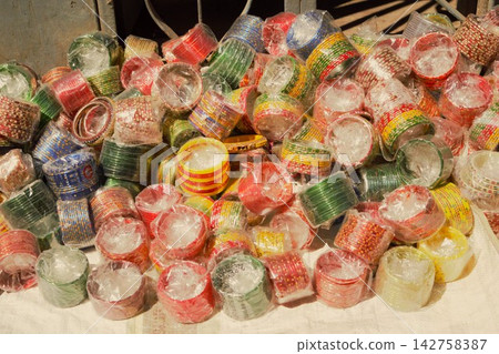 Colorful glass bangles sold at a market in Bhaktapur, Nepal. Colorful glass bangles sold at a market in Bhaktapur, Nepal. 142758387