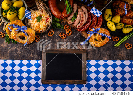 Oktoberfest food: beer, pretzel, sausages, stewed cabbage, potato Oktoberfest food: beer, pretzel, sausages, stewed cabbage, potato 142758456