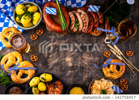 Oktoberfest food: beer, pretzel, sausages, stewed cabbage, potato Oktoberfest food: beer, pretzel, sausages, stewed cabbage, potato 142758457