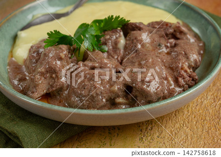 liver beef stroganoff with mashed potatoes, table setting in green tones, homemade, liver beef stroganoff with mashed potatoes, table setting in green tones, homemade, 142758618