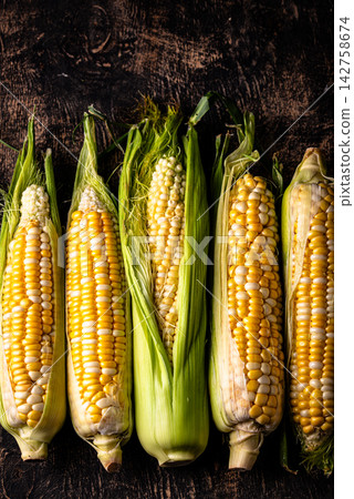 Raw uncooked fresh corn. Healthy food Raw uncooked fresh corn. Healthy food 142758674