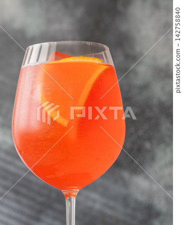 Vibrant Campari Spritz cocktail with citrus ice bubbles elegant Italian aperitif presentation Vibrant Campari Spritz cocktail with citrus ice bubbles elegant Italian aperitif presentation 142758840