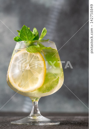 Refreshing Hugo Spritz cocktail with lemon mint ice bubbles and elegant summer presentation Refreshing Hugo Spritz cocktail with lemon mint ice bubbles and elegant summer presentation 142758849