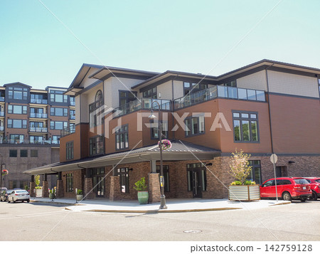 Modern multi-story apartment and retail building in Ruston - June 13, 2026 Ruston WA, USA Modern multi-story apartment and retail building in Ruston - June 13, 2026 Ruston WA, USA 142759128