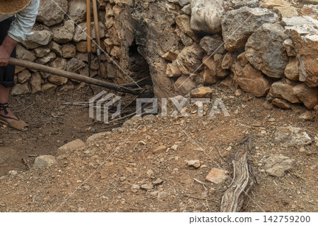 Traditional stone furnace oven for heating water in rural Spain during raisin drying Traditional stone furnace oven for heating water in rural Spain during raisin drying 142759200