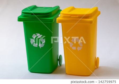 Green and yellow recycling bins isolated on white background Green and yellow recycling bins isolated on white background 142759975