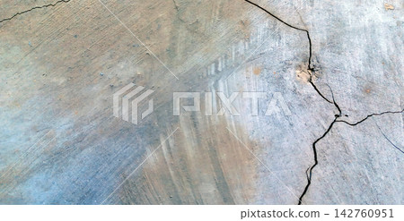Cracked Grey and Earthy Concrete Surface Texture 142760951