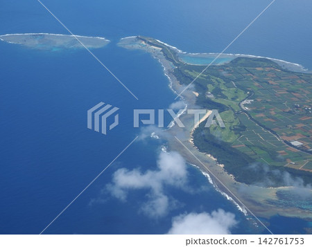 A spectacular cape jutting out into the Pacific Ocean. A view of Higashi-Hennazaki Cape and its beautiful reef line from above Miyako Island, Okinawa. A spectacular cape jutting out into the Pacific Ocean. A view of Higashi-Hennazaki Cape and its beautiful reef line from above Miyako Island, Okinawa. 142761753