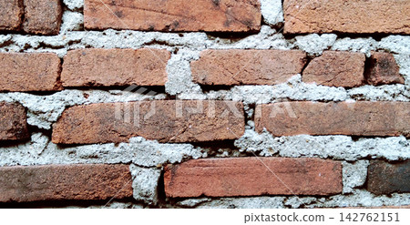 Rustic Red Brick Wall with Grey Cement Mortar Texture 142762151