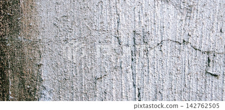 Weathered Stained Concrete Wall with Horizontal Crack Texture 142762505