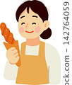 Woman Baker Holding Bread 142764059