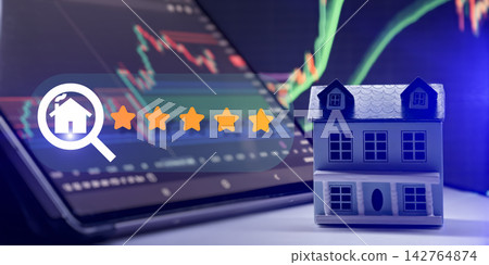 Real estate investment concept with five star rating, miniature house, and financial stock market charts Real estate investment concept with five star rating, miniature house, and financial stock market charts 142764874