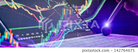 Oil commodity trading concept with digital stock market charts and coins on a laptop keyboard Oil commodity trading concept with digital stock market charts and coins on a laptop keyboard 142764875