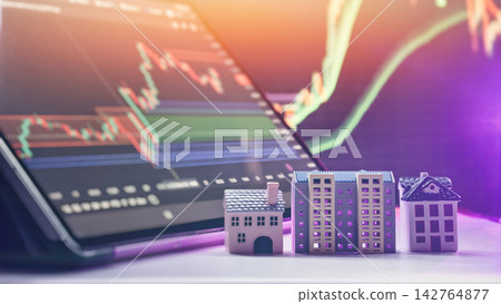 market trends and mortgage interest rates analysis. Toy houses against a background of stock market candlestick graphs market trends and mortgage interest rates analysis. Toy houses against a background of stock market candlestick graphs 142764877