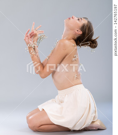 Topless young woman posing in in bright minimalist studio environment Topless young woman posing in in bright minimalist studio environment 142765197