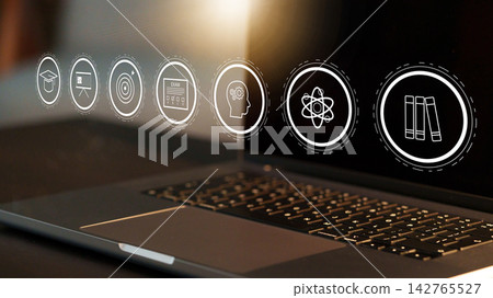 E learning tools on laptop screen with various educational icons and symbols E learning tools on laptop screen with various educational icons and symbols 142765527