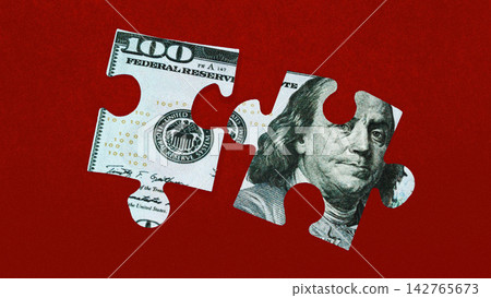Puzzle pieces of a one hundred dollar bill on a red background show details of the currency design Puzzle pieces of a one hundred dollar bill on a red background show details of the currency design 142765673