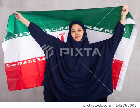 Young woman in hijab posing with Iran flag Young woman in hijab posing with Iran flag 142766002