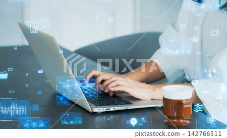 Woman using a laptop and digital technology Woman using a laptop and digital technology 142766511