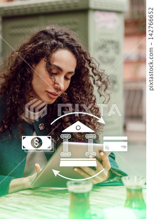 Online payment activity in a cafe with a woman using a tablet 142766652