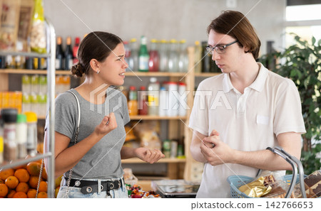 Wife and husband shout at each other, insult and accuse, express dissatisfaction Wife and husband shout at each other, insult and accuse, express dissatisfaction 142766653