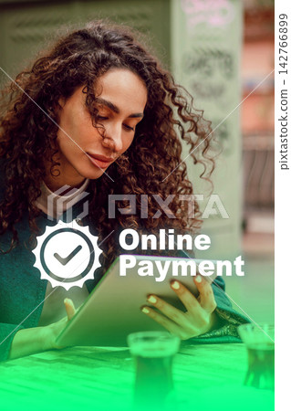 Woman uses tablet to make online payment while sitting in a cafe Woman uses tablet to make online payment while sitting in a cafe 142766899