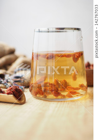 Goji berries are commonly steeped in hot water Goji berries are commonly steeped in hot water 142767033