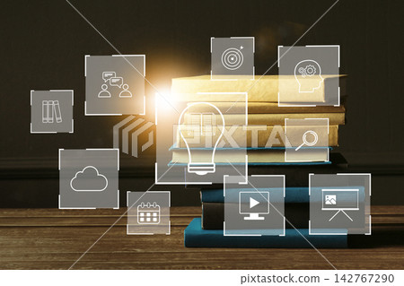 E learning tools and concepts represented with books and icons on a table in a well-lit study area E learning tools and concepts represented with books and icons on a table in a well-lit study area 142767290