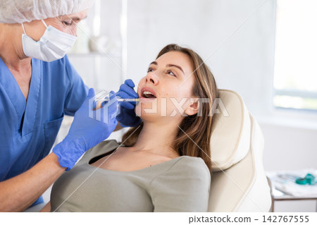 Facial injection young patient, closeup 142767555