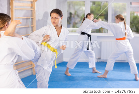 Females in kimono practicing fighting moves Females in kimono practicing fighting moves 142767652