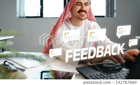 Man receives feedback while working at a desk in a bright office setting Man receives feedback while working at a desk in a bright office setting 142767660