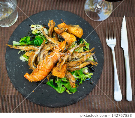Grilled seafood and fish are specialty at coastal restaurant Grilled seafood and fish are specialty at coastal restaurant 142767828