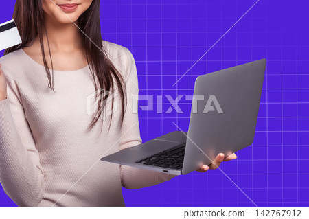Online payment process with a woman using a laptop and holding a credit card Online payment process with a woman using a laptop and holding a credit card 142767912