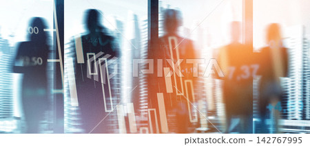 Business professionals look at financial charts in an office during the day 142767995
