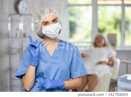 Young doctor with mask Young doctor with mask 142768003