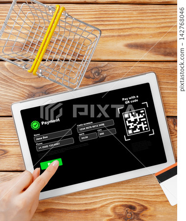 Payment process on a tablet using a QR code in a shopping setting Payment process on a tablet using a QR code in a shopping setting 142768046