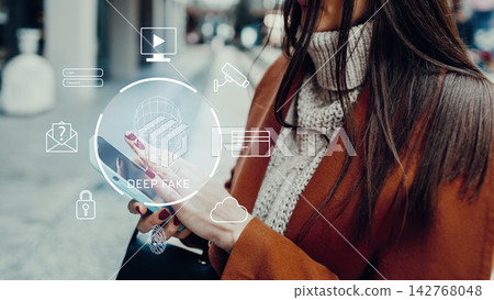 Person uses a smartphone while icons related to deep fake technology appear on the screen in a busy urban area Person uses a smartphone while icons related to deep fake technology appear on the screen in a busy urban area 142768048