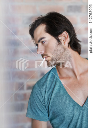 Brick wall, man and smoking cigarette for relax, thinking and 420 for drug abuse problem on background. Nicotine, person and addiction to marijuana, weed and cbd for unhealthy cannabis in profile 142768093