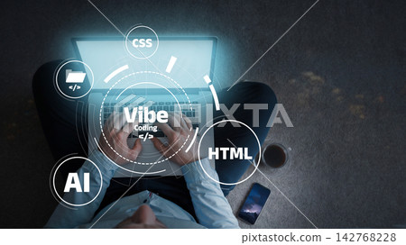 Working on vibe coding during nighttime while using a laptop and coffee nearby Working on vibe coding during nighttime while using a laptop and coffee nearby 142768228