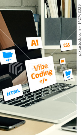 Vibe coding workspace with laptop showing programming elements like HTML and AI at a simple desk Vibe coding workspace with laptop showing programming elements like HTML and AI at a simple desk 142768329