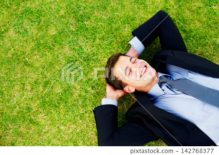 Businessman, grass and smile with top view and calm, relax and outdoor for break from work. Tired, green and meadow for corporate male person in nature, field and fresh air for stress management Businessman, grass and smile with top view and calm, relax and outdoor for break from work. Tired, green and meadow for corporate male person in nature, field and fresh air for stress management 142768377