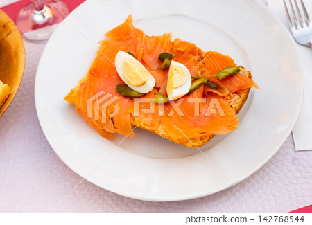Delicious sandwich with fish and eggs Delicious sandwich with fish and eggs 142768544
