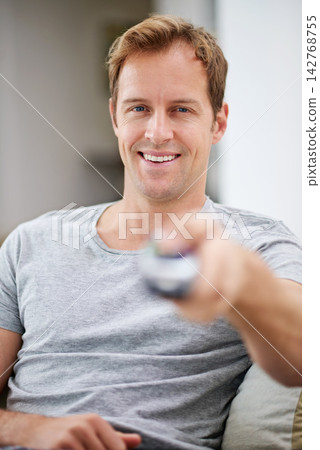 Portrait, smile and man watching tv in home living room sofa for movie, video or stream show to relax. Face, happy person and television remote control in lounge for film, news or media entertainment Portrait, smile and man watching tv in home living room sofa for movie, video or stream show to relax. Face, happy person and television remote control in lounge for film, news or media entertainment 142768755