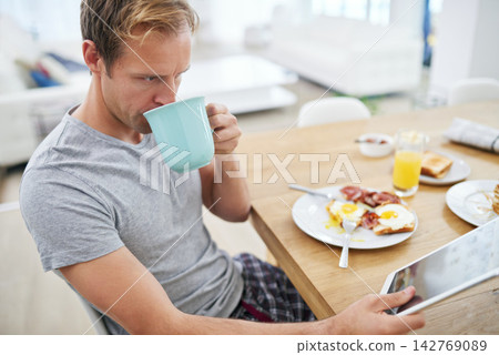 Tablet, breakfast and man with coffee or news for reading info on elections to relax in morning. Home, tea or voter at brunch for healthy nutrition with online announcement, article or story update Tablet, breakfast and man with coffee or news for reading info on elections to relax in morning. Home, tea or voter at brunch for healthy nutrition with online announcement, article or story update 142769089