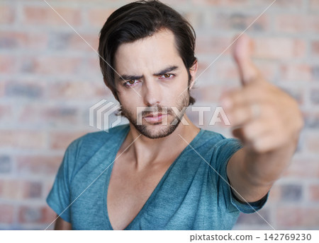 Angry, portrait and man by brick wall with hand gun, confidence or edgy tshirt in Germany. Male person, face or cool model with violence gesture for shooting weapon, pistol fingers or self defence Angry, portrait and man by brick wall with hand gun, confidence or edgy tshirt in Germany. Male person, face or cool model with violence gesture for shooting weapon, pistol fingers or self defence 142769230