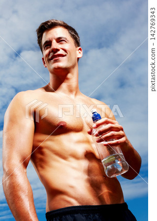 Body, man and shirtless with water low angle in outdoor with energy from cardio training, exercise and running. Smile, athlete and person thinking for sports workout, performance and runner goal 142769343