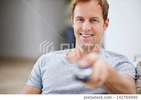 Portrait, smile and man watch television in home living room sofa for movie, video or streaming show to relax. Face, happy person and tv remote control in lounge for film, news or media entertainment Portrait, smile and man watch television in home living room sofa for movie, video or streaming show to relax. Face, happy person and tv remote control in lounge for film, news or media entertainment 142769400