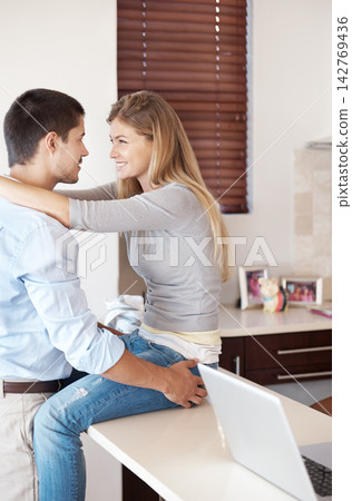 Home, kitchen and couple hug with love, care and support in partnership with trust. Happy, marriage and man embrace woman with gratitude, kindness and people in house talking in living room and relax Home, kitchen and couple hug with love, care and support in partnership with trust. Happy, marriage and man embrace woman with gratitude, kindness and people in house talking in living room and relax 142769436