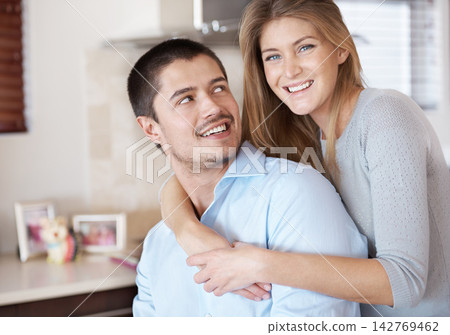 Marriage, couple and portrait of hug in home with love, care and support in partnership with trust. Happy, woman and man smile with gratitude in house and wife embrace with kindness and loyalty 142769462