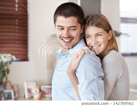 Happy man, woman and hug in kitchen for love, romance and support at home. Couple, together and smile in house for trust, comfort and affection in marriage and commitment or happiness and care Happy man, woman and hug in kitchen for love, romance and support at home. Couple, together and smile in house for trust, comfort and affection in marriage and commitment or happiness and care 142769562